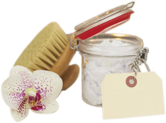 A glass jar with a red seal contains bath salts, accompanied by a wooden brush and a white orchid, reminiscent of a serene massage therapy session in Ottawa. A blank tag is attached to the jar.